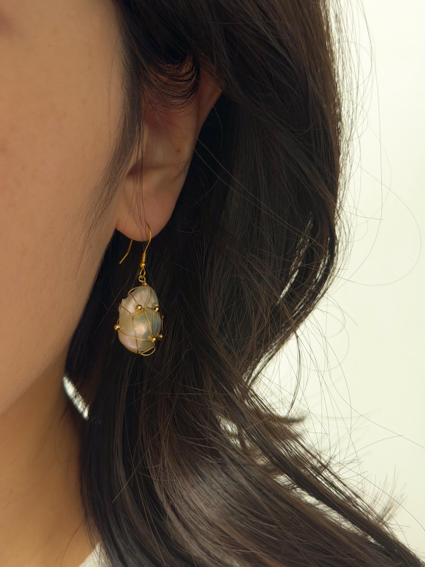 Additional view of wire wrapped baroque pearl drop earrings by Le Jardin Perles