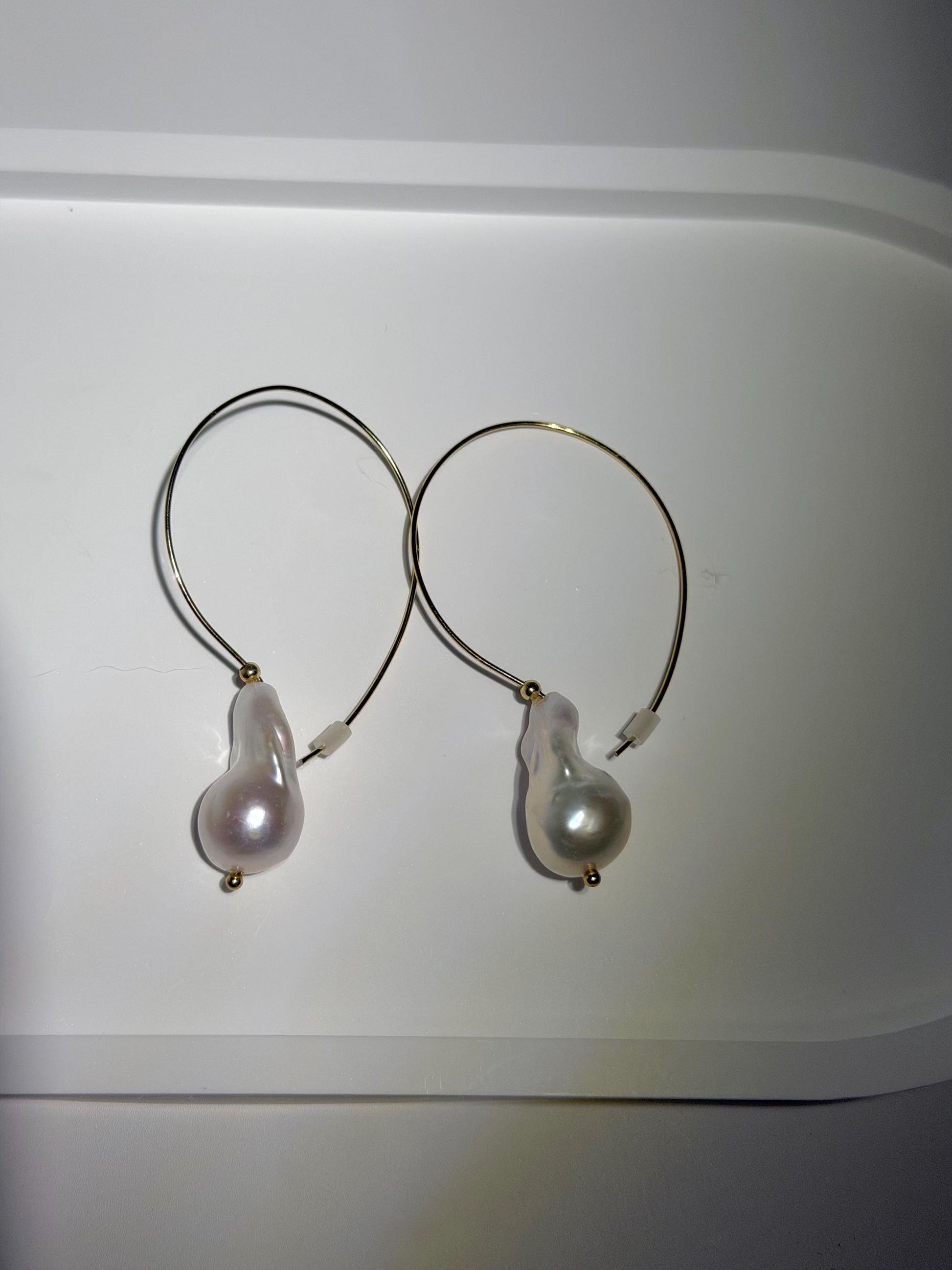 Additional view of elongated baroque pearl hoop earrings by Le Jardin Perles