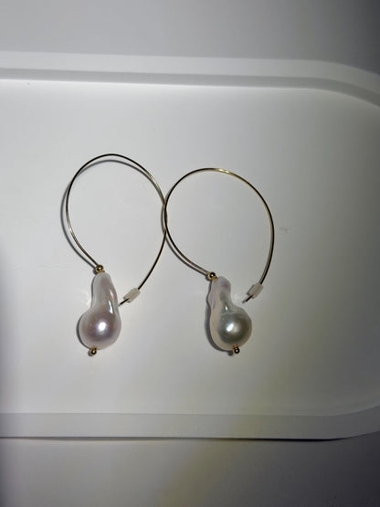 Additional view of elongated baroque pearl hoop earrings by Le Jardin Perles