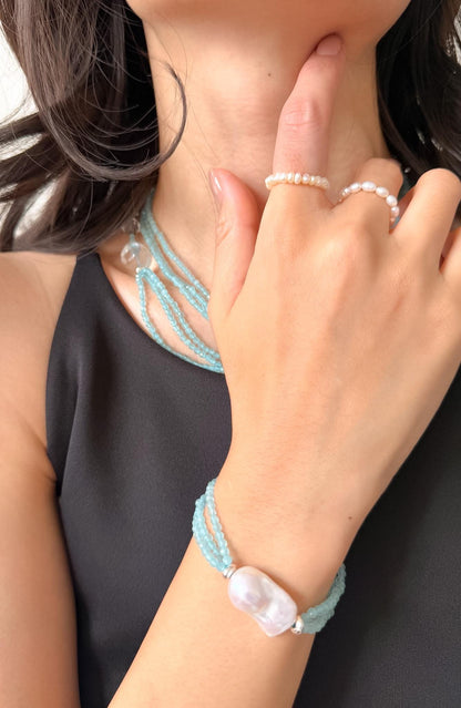 Additional view of layered blue cat eye bracelet by Le Jardin Perles