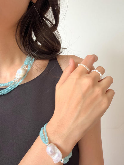 Additional view of layered blue cat eye necklace by Le Jardin Perles