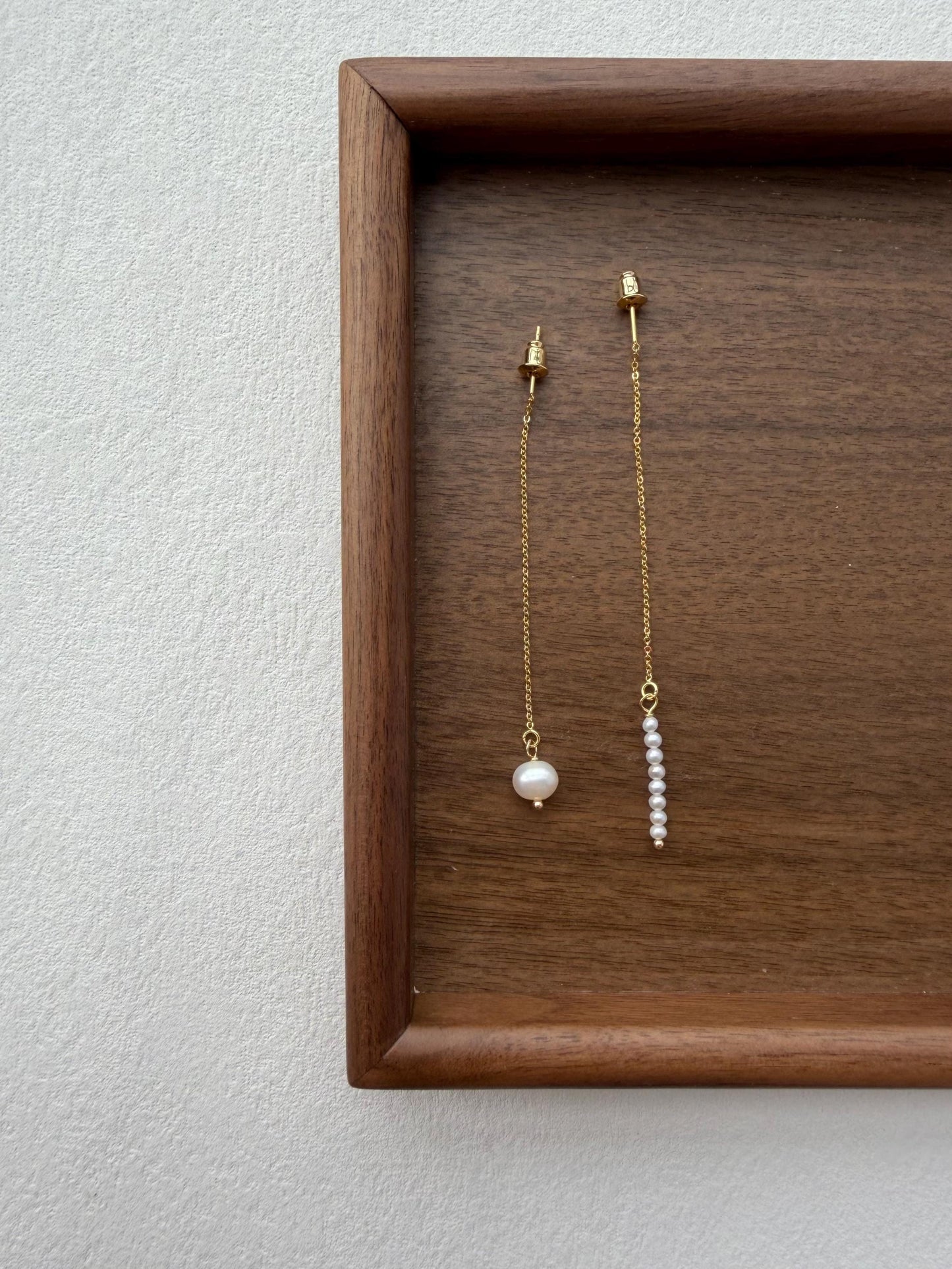 Additional view of asymmetrical freshwater pearl threader earrings by Le Jardin Perles