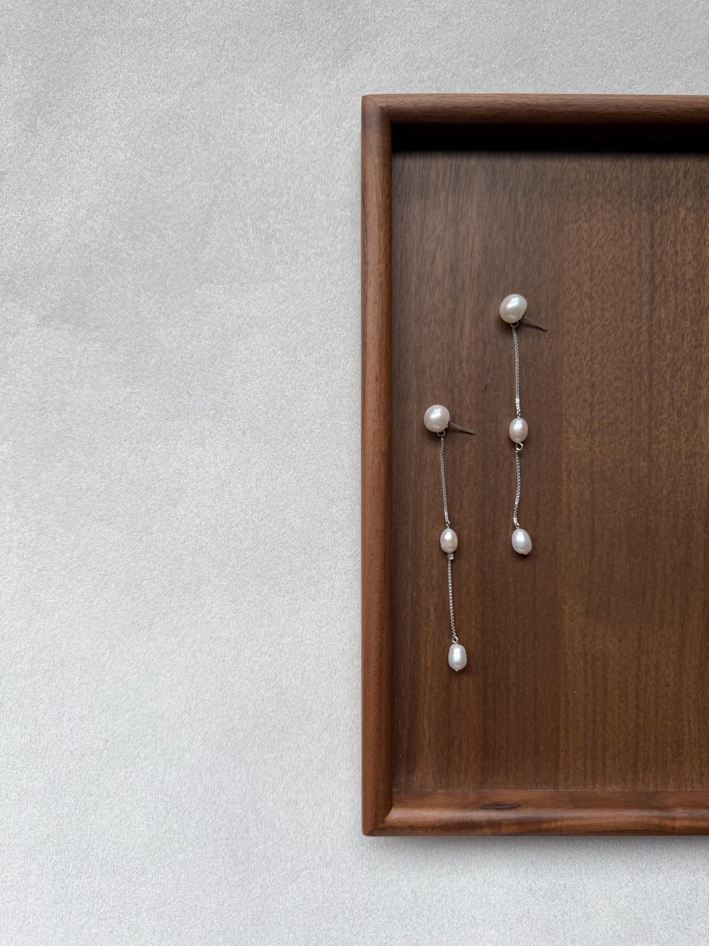 Additional view of french minimalist pearl drop earrings by Le Jardin Perles