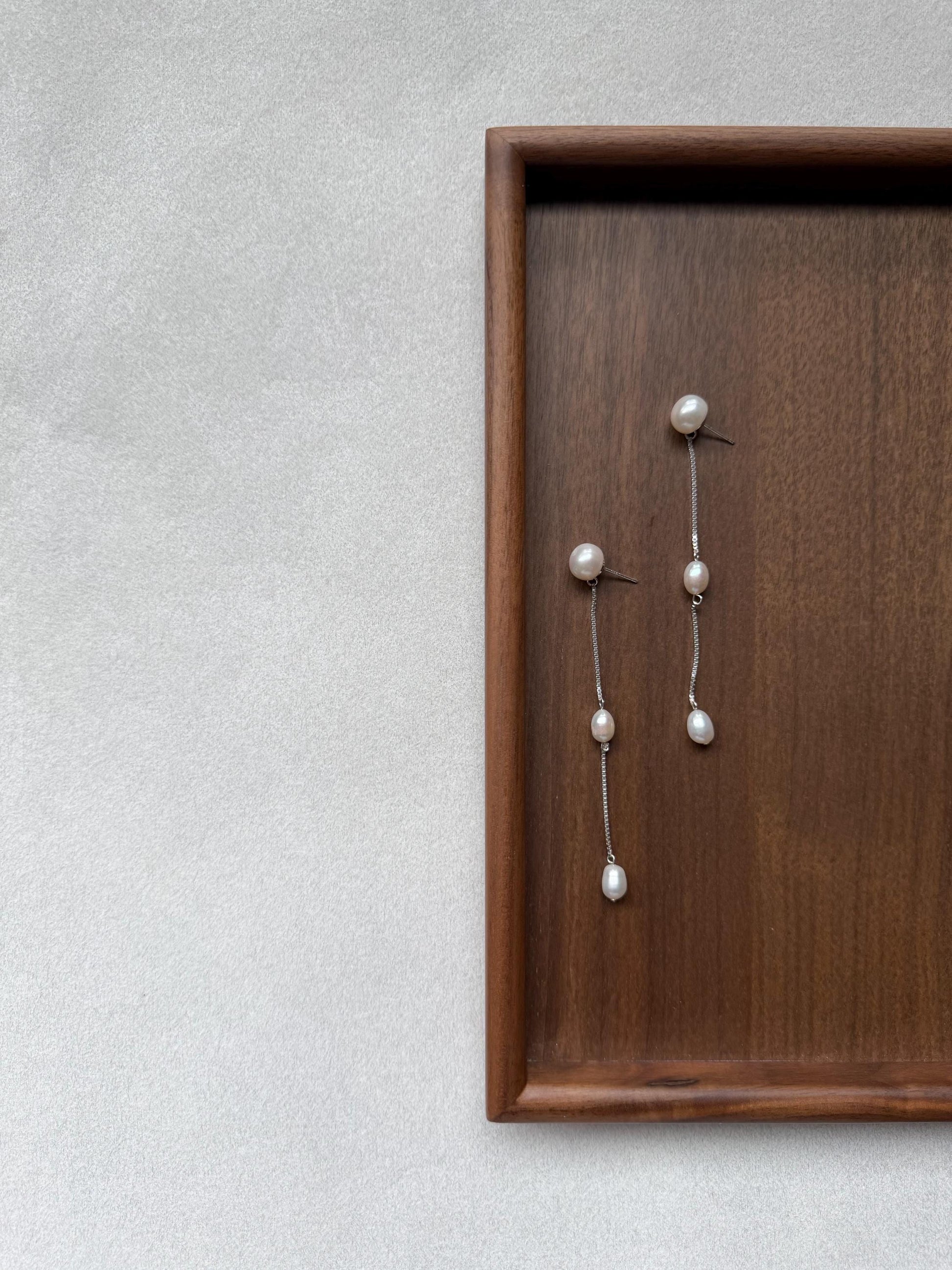 Additional view of french minimalist pearl drop earrings by Le Jardin Perles